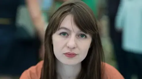 Irish author Sally Rooney states she will not visit the UK over potential arrest